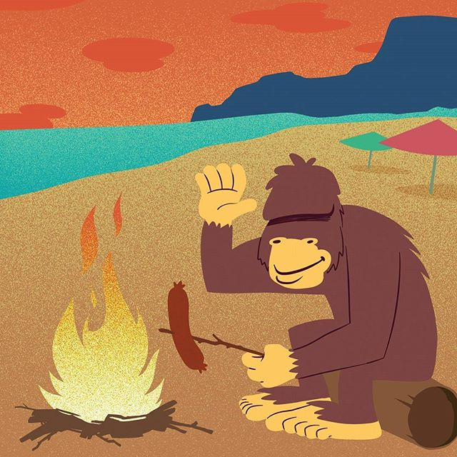 Bigfoot roasting a hotdog over a fire on the beach and giving a friendly wave.